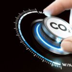 Man,Turning,A,Carbon,Dioxide,Knob,To,Reduce,Emissions.,Co2